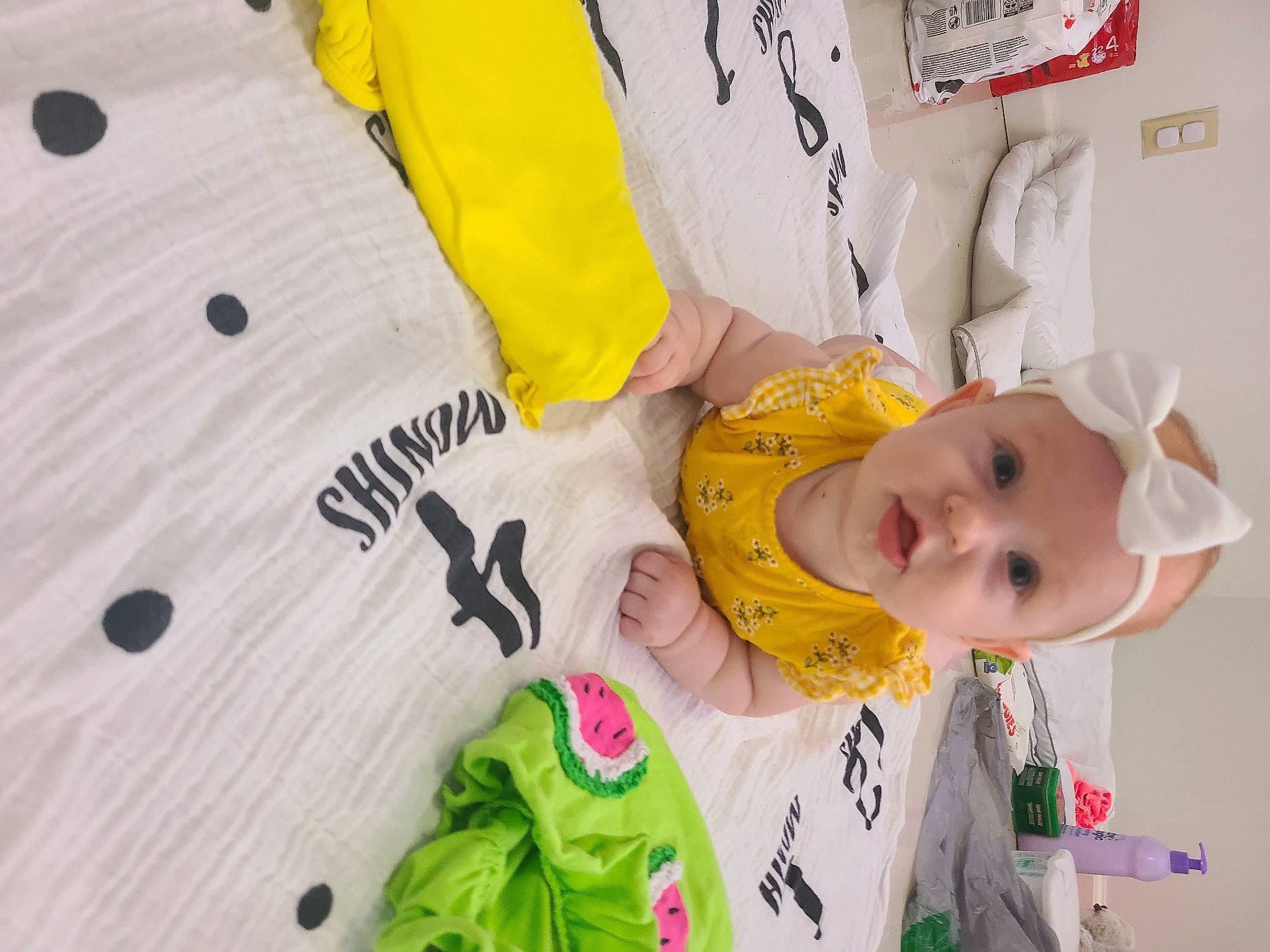 Salem is registered to the contest to win money with this photo: baby, baby_products, baby_safety, baby_toddler_clothing, cheek, child, font, fun, happy, headwear, linens, person, room, sleeve, t_shirt, textile, toddler, white, yellow