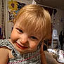 Charley joined the competition — help win amazing prizes! toddler, child, blonde_hair, smile, indoor, dress, face, curious, playful, portrait, person, baby, home, decor, table, shoe, high_chair, wall_art, human, cute