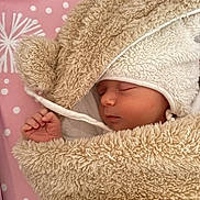 Evanna participe au concours pour gagner de l'argent avec cette photo : baby, sleeping, blanket, hood, soft, cozy, infant, pink_background, polka_dots, cute, newborn, wrapped, peaceful, child, face, hand, warm, resting, fabric, bed