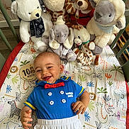Lylio a rejoint le concours — aidez-le/la à gagner de superbes lots ! animal_print, baby, bear, blue_clothing, child, colorful_blanket, cute, donald_duck, elephant, fabric, giraffe, happy, indoor, infant, playful, plush_toys, sheep, smiling, toddler, toy_collection
