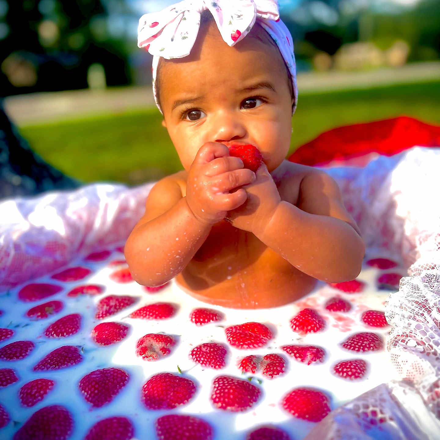 Jailani joined the competition — help win amazing prizes! baby, child, closeup, cute, food, fruit, hands, happy, headband, infant, milk, milk_bath, nature, outdoor, playful, portrait, sitting, skin, strawberry, summer