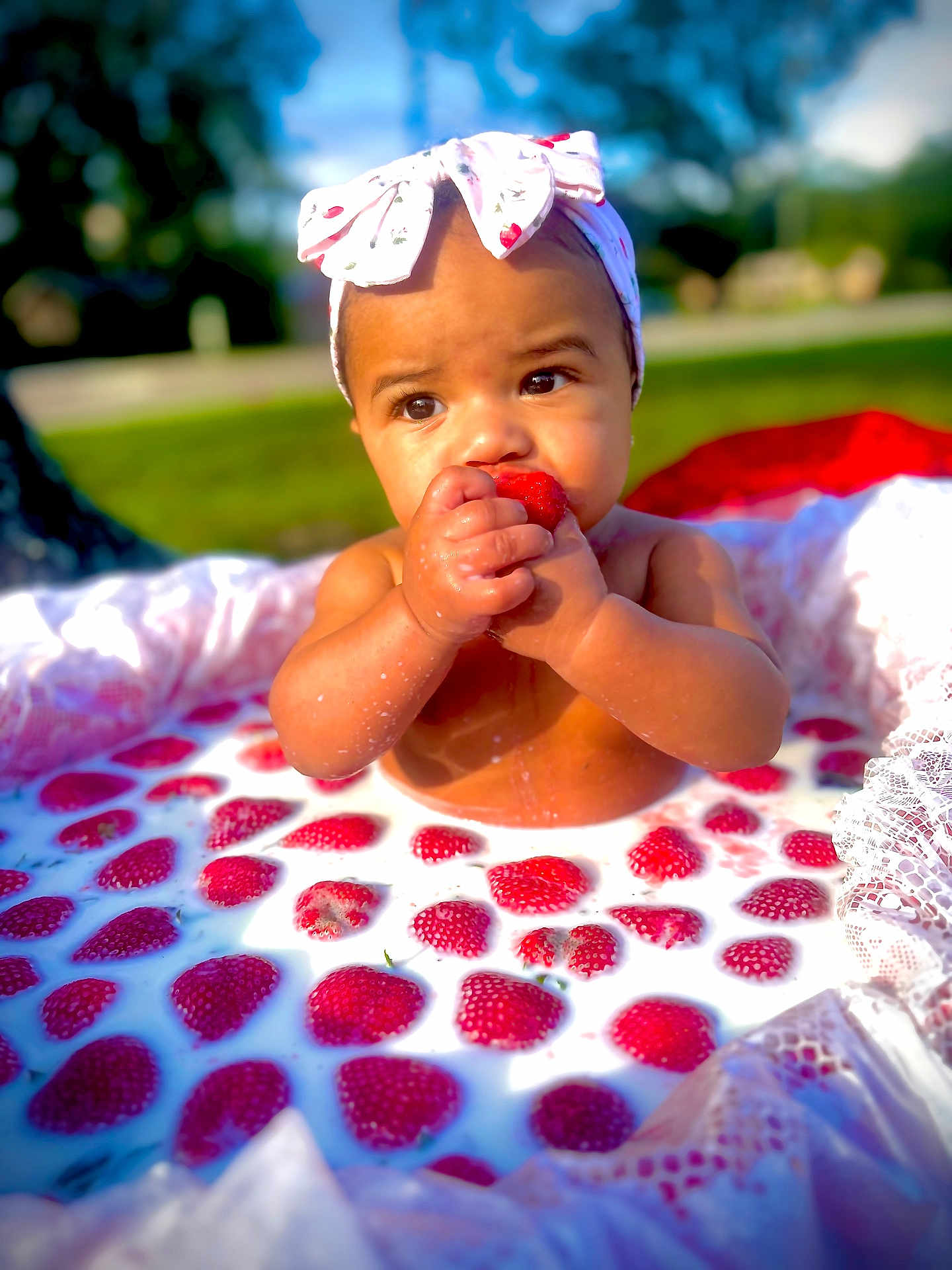 Jailani joined the competition — help win amazing prizes! baby, child, strawberry, milk, headband, outdoor, nature, food, fruit, cute, infant, skin, summer, playful, sitting, milk_bath, closeup, portrait, happy, hands