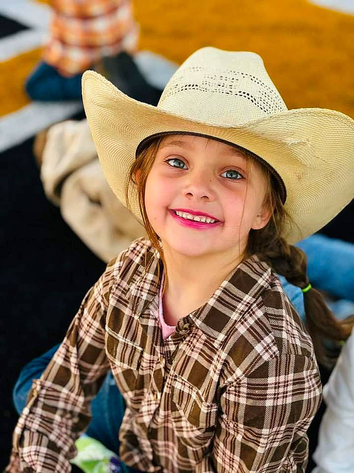 Kathleen is registered to the contest to win money with this photo: blond, cap, cool, cowboy_hat, eye, fedora, flash_photography, fun, happy, hat, headgear, headwear, human, joy, leisure, pattern, people_in_nature, person, plaid, smile
