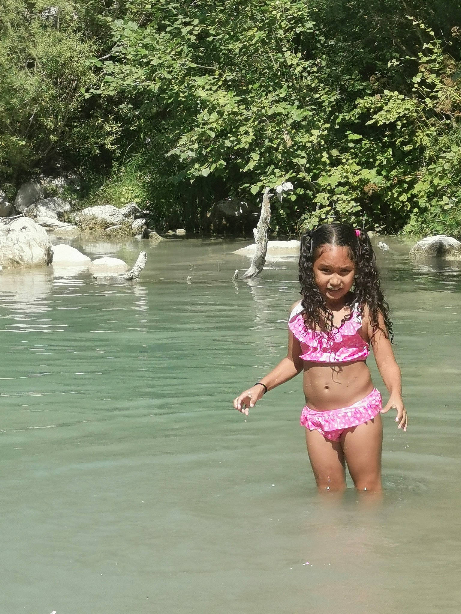 Nelia participe au concours pour gagner de l'argent avec cette photo : bathing, fun, grass, jungle, lake, leisure, mammal, monokini, one_piece_swimsuit, person, plant, recreation, swimsuit_top, swimwear, thigh, toddler, tree, underpants, vertebrate, waist