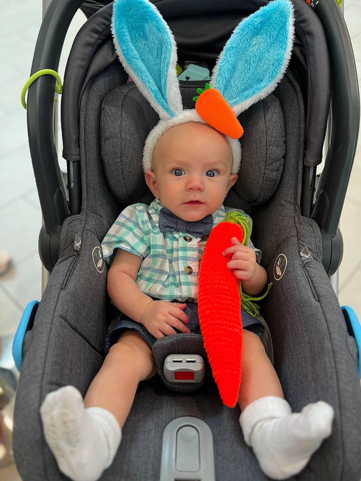Logan joined the competition — help win amazing prizes! arm, auto_part, baby, baby_carriage, baby_products, baby_safety, baby_toddler_clothing, bag, blue, cap, car_seat, comfort, fashion_accessory, finger, person, photograph, product, sitting, toddler, wheel