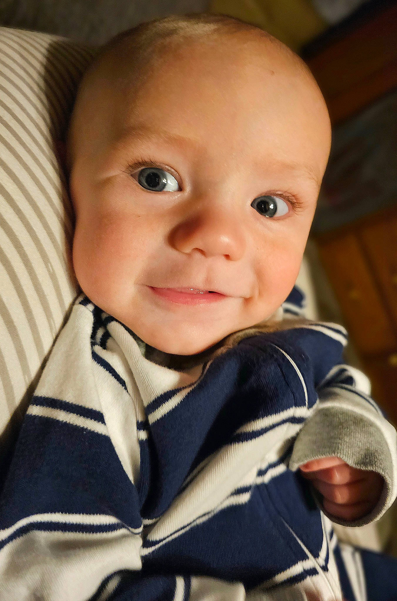 Logan joined the competition — help win amazing prizes! baby, baby_products, baby_toddler_clothing, cheek, child, chin, collar, comfort, eye, flash_photography, fun, happy, iris, laugh, person, portrait_photography, sitting, sleeve, smile, t_shirt