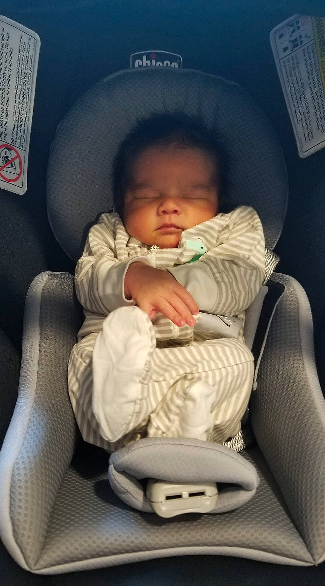 Joziah is registered to the contest to win money with this photo: arm, baby, baby_in_car_seat, baby_toddler_clothing, car_seat, cheek, child, comfort, finger, hairstyle, head, lap, leg, mammal, mouth, organ, person, skin, thumb, toddler