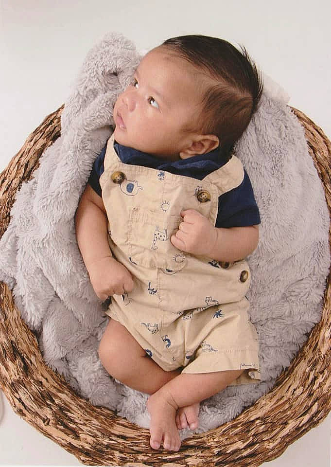 Joziah joined the competition — help win amazing prizes! baby, baby_toddler_clothing, basket, child, comfort, doll, dress, face, happy, head, headgear, human_body, linens, outerwear, person, product, skin, sleeve, toddler, wood
