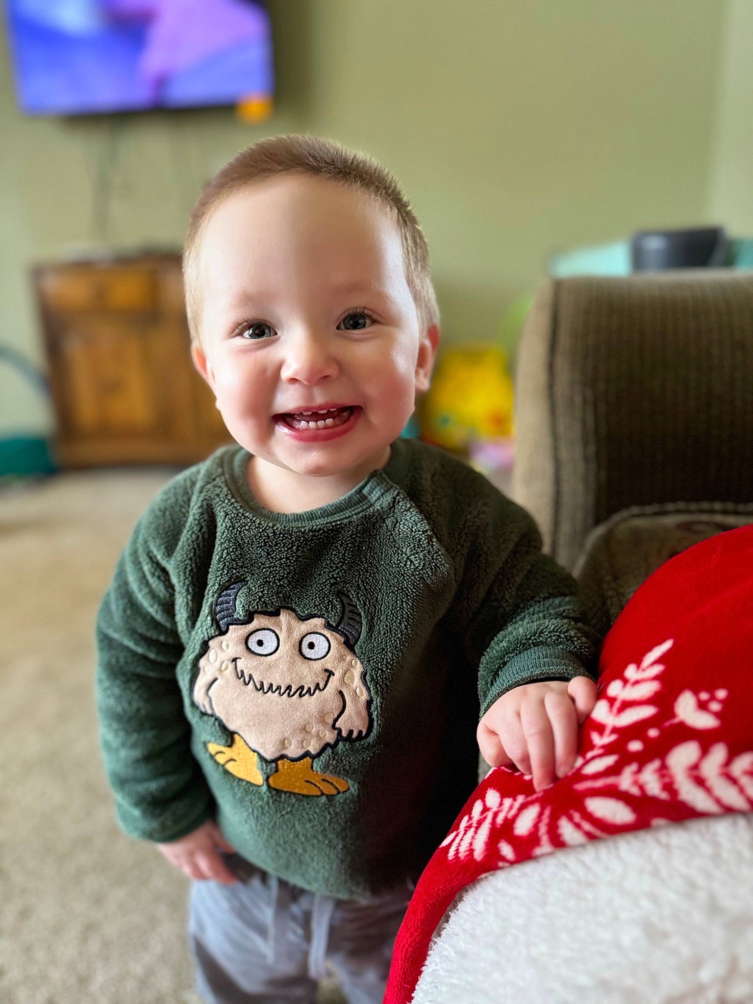 Jesse is registered to the contest to win money with this photo: baby, baby_toddler_clothing, cheek, child, dress, eye, face, facial_expression, flooring, hair, hairstyle, happy, head, iris, joy, person, sitting, skin, sleeve, smile