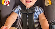 Richie is registered to the contest to win money with this photo: baby, beanie, blue_eyes, car_seat, child, clothing, feet, happy, hat, indoors, infant, photography, portrait, safety_harness, sitting, smiling, striped_shirt, toes, transportation, vehicle