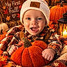 autumn, baby, beanie, blanket, candle, child, cozy, fall, happy, hat, infant, lantern, leaves, outdoor_decor, plaid, portrait, pumpkin, pumpkins, smiling, warm_lighting
