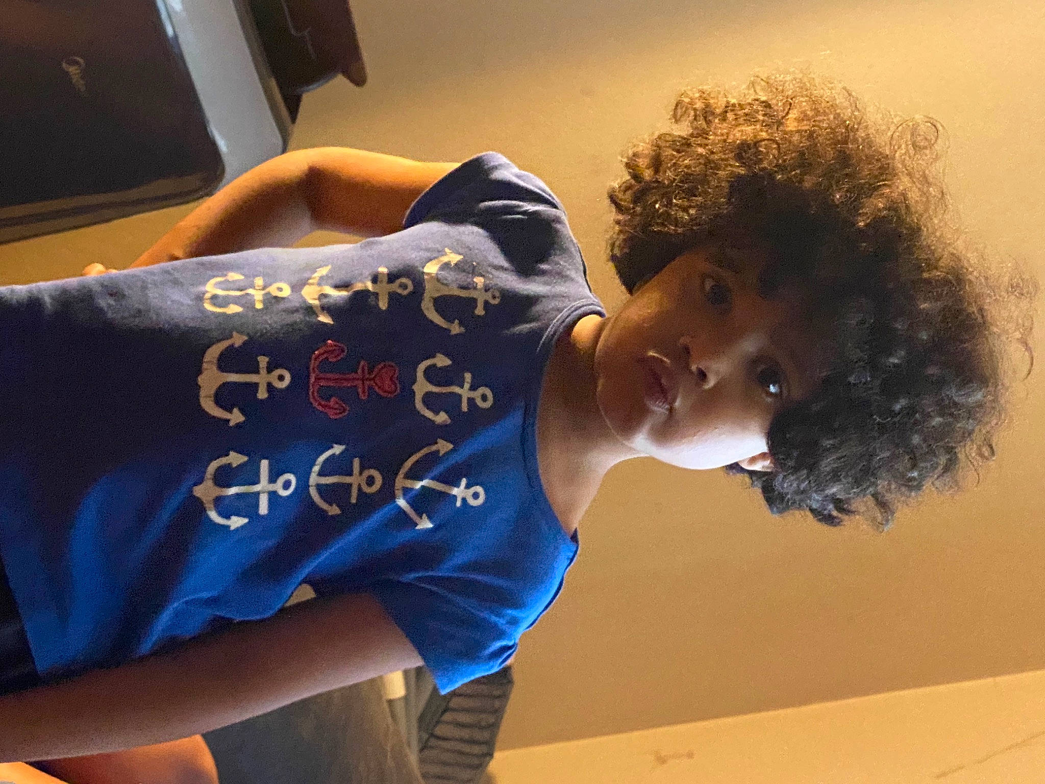 Harlyn joined the competition — help win amazing prizes! afro, child, elbow, electric_blue, fashion_design, flooring, fun, hairstyle, happy, human_leg, joint, neck, person, shoulder, sitting, sleeve, t_shirt, television, thigh, trunk