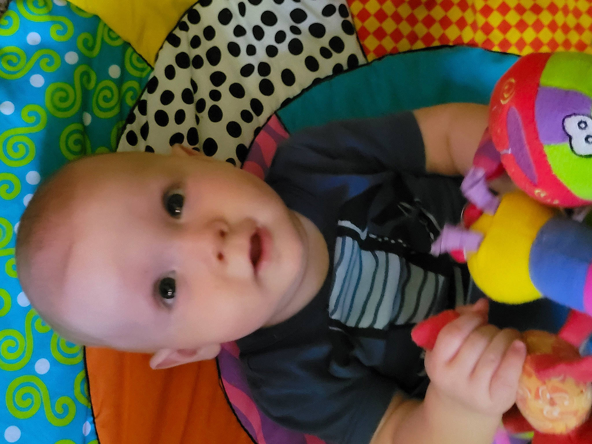 Samuel is registered to the contest to win money with this photo: baby, baby_playing_with_toys, baby_products, baby_safety, baby_toddler_clothing, baby_toys, cheek, child, fun, happy, nose, pattern, person, play, product, room, stuffed_toy, textile, toddler, toy