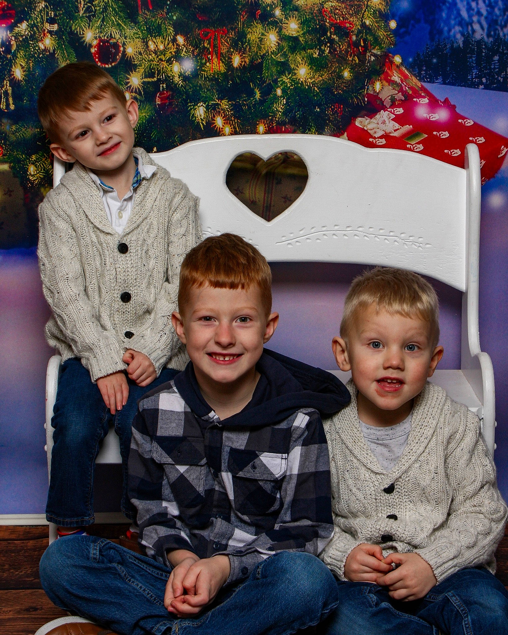 Ricky is registered to the contest to win money with this photo: blue, child, christmas_ornament, christmas_tree, clothing, event, facial_expression, family_taking_photos_together, fun, happy, jeans, joy, leisure, organ, person, photograph, smile, snapshot, social_group, standing