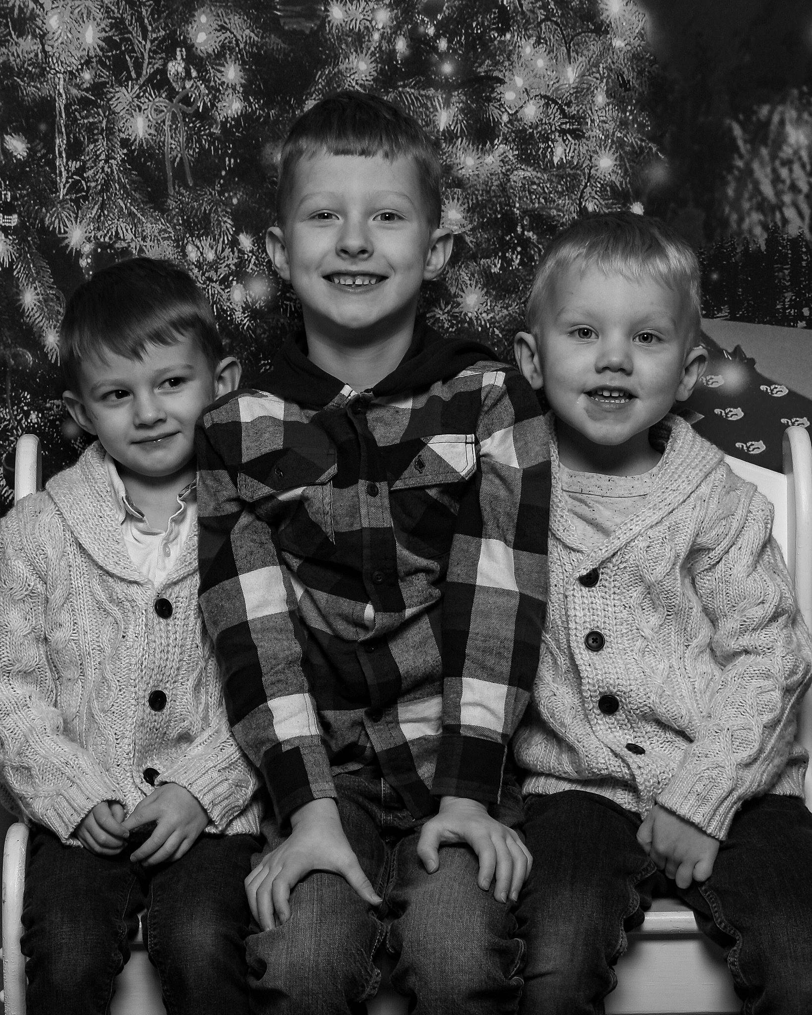 Ricky is registered to the contest to win money with this photo: black, black_and_white, child, clothing, face, facial_expression, fun, hair, hairstyle, happy, head, human_body, joy, monochrome, people, person, photograph, smile, standing, tartan