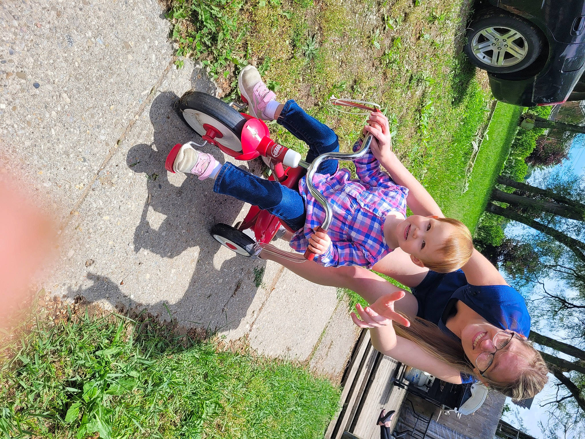 Isabell joined the competition — help win amazing prizes! adventure, automotive_exterior, automotive_tire, car, fun, grass, joy, landscape, leisure, motor_vehicle, people_in_nature, person, plant, recreation, sandal, shadow, shorts, tire, tree, vehicle