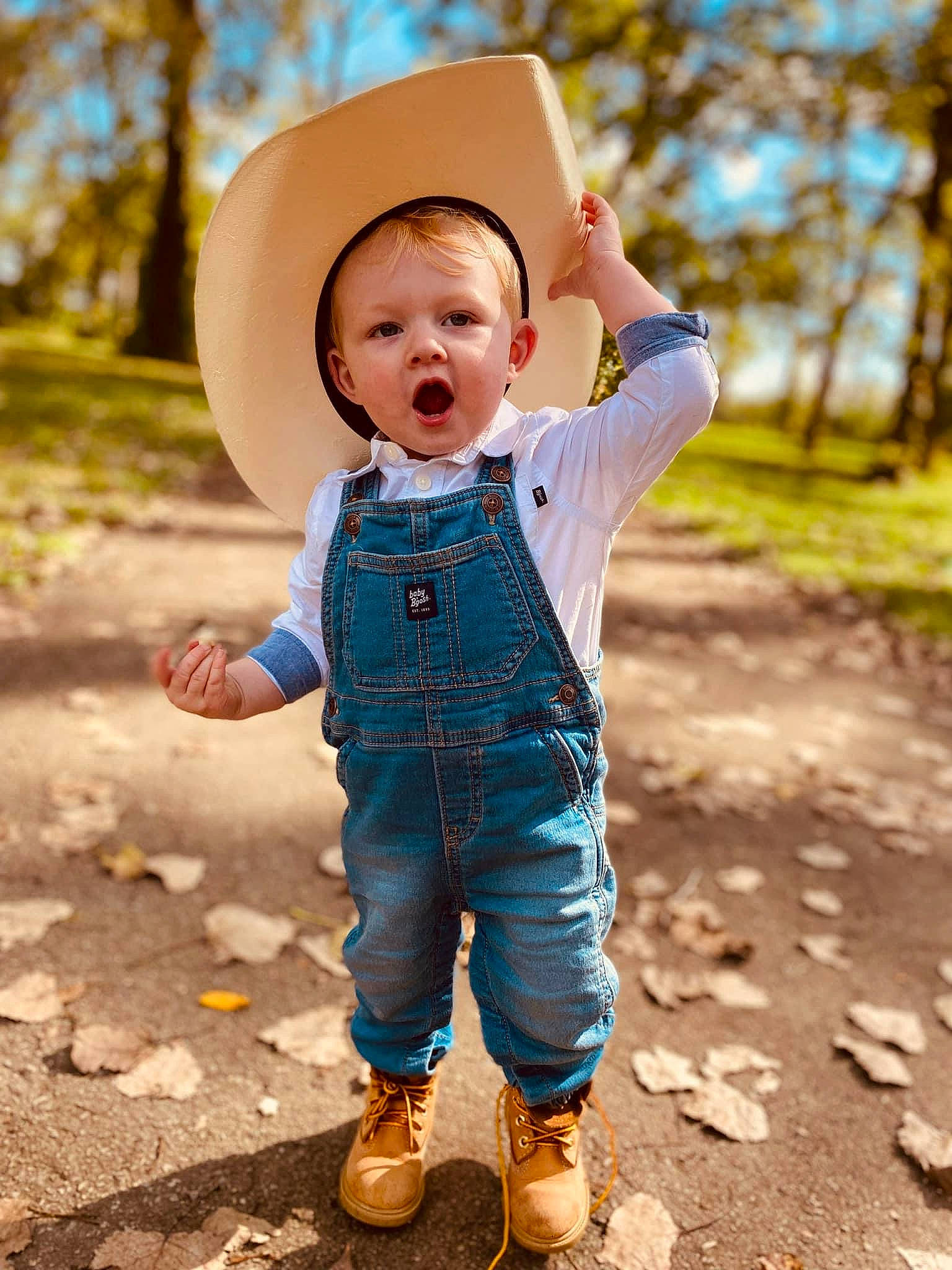Bentley joined the competition — help win amazing prizes! baby, baby_toddler_clothing, electric_blue, flash_photography, fun, gesture, grass, hand, happy, hat, landscape, leaf, leisure, people_in_nature, person, sleeve, smile, sun_hat, surprise, toddler
