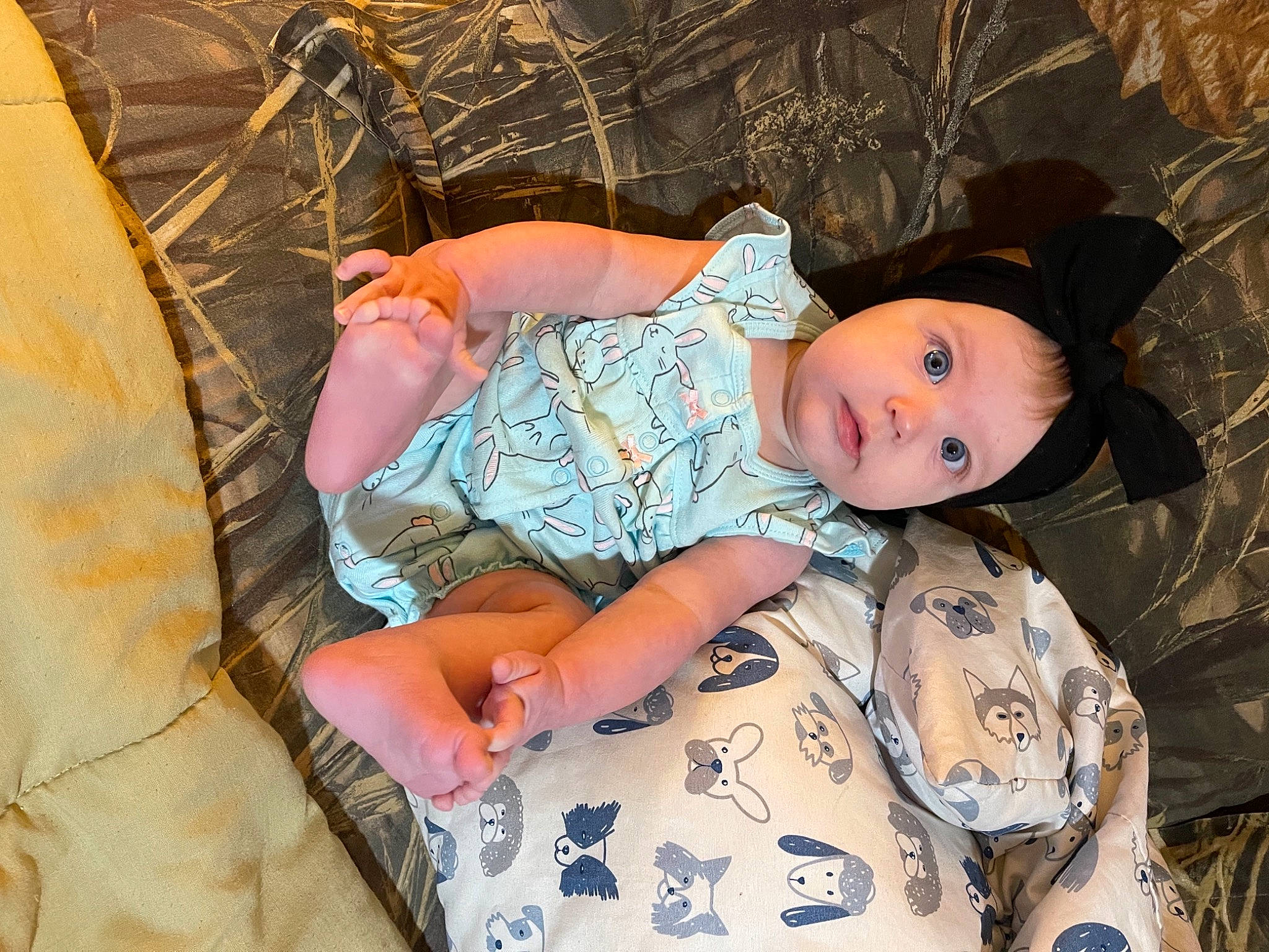 Berkley is registered to the contest to win money with this photo: baby, baby_toddler_clothing, child, comfort, cool, facial_expression, fashion_accessory, grass, hat, headgear, linens, pattern, person, sitting, skin, sleeve, sun_hat, textile, thigh, toddler