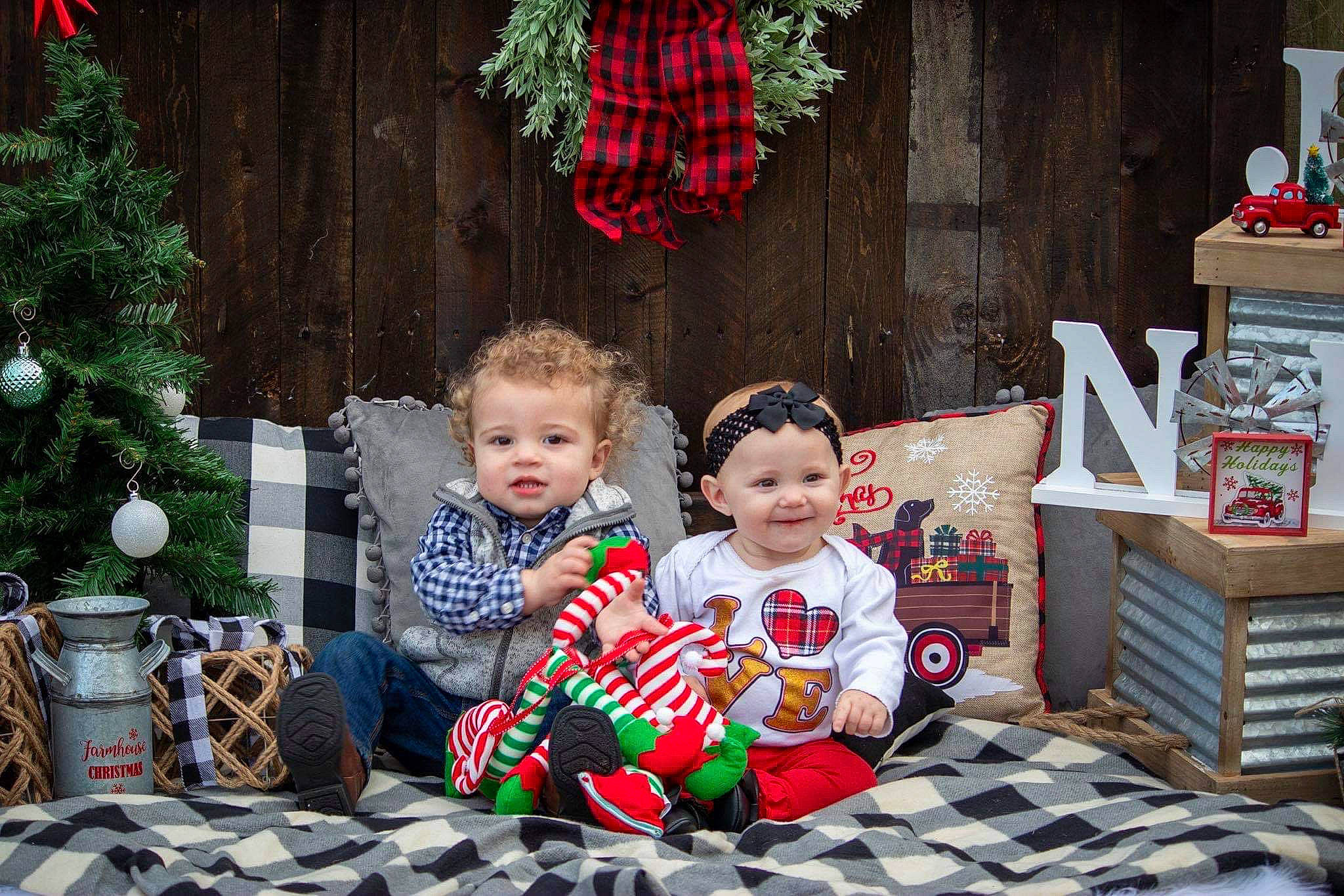 Xyla joined the competition — help win amazing prizes! child, christmas, christmas_decoration, christmas_eve, christmas_ornament, christmas_tree, event, holiday, home, interior_design, joy, lap, person, room, sitting, toddler, tree