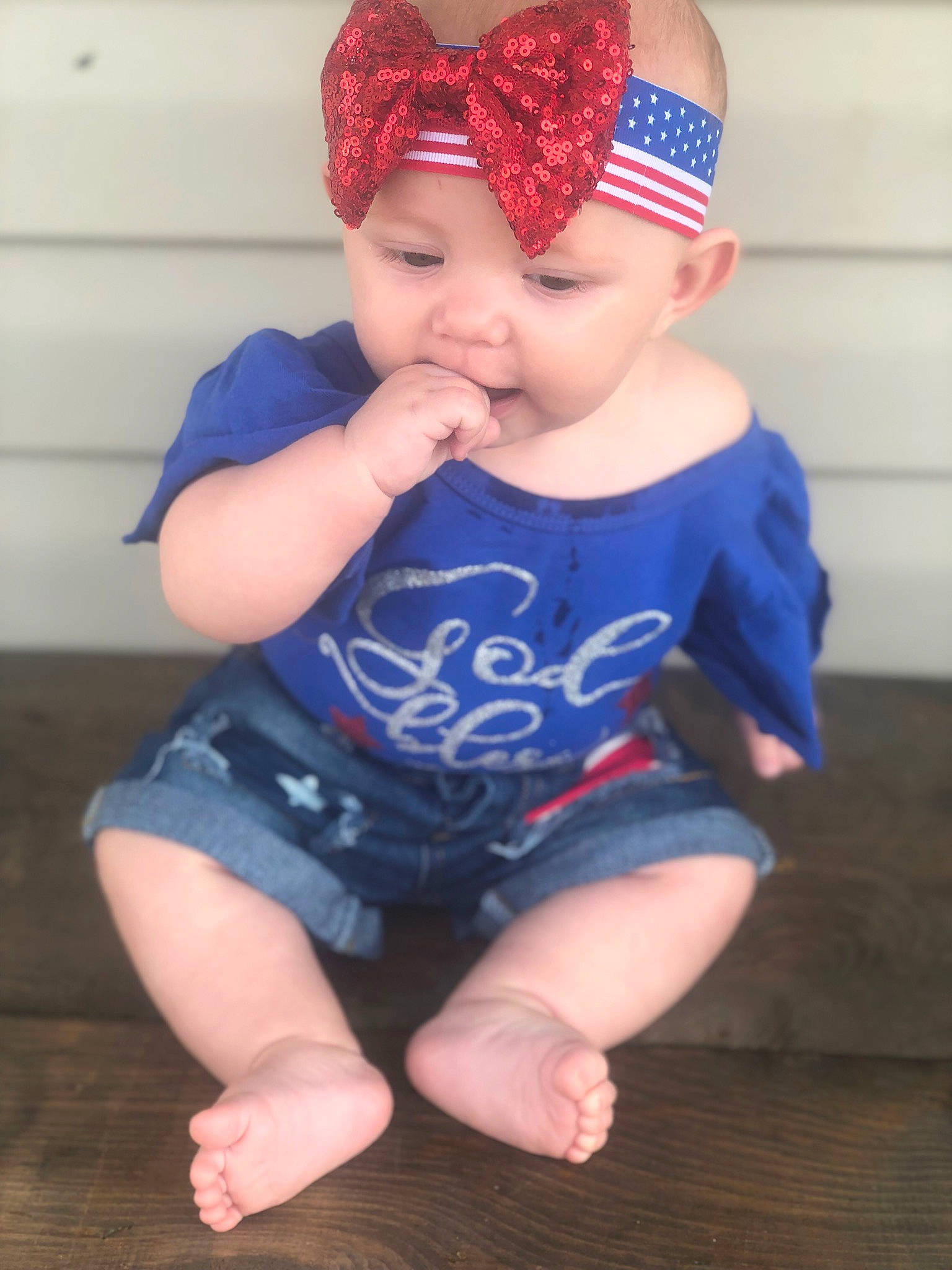Xyla is registered to the contest to win money with this photo: baby, baby_toddler_clothing, bandana, blue, cap, cheek, child, clothing, electric_blue, hair_accessory, headband, headgear, headwear, leg, lip, person, pink, red, sitting, skin