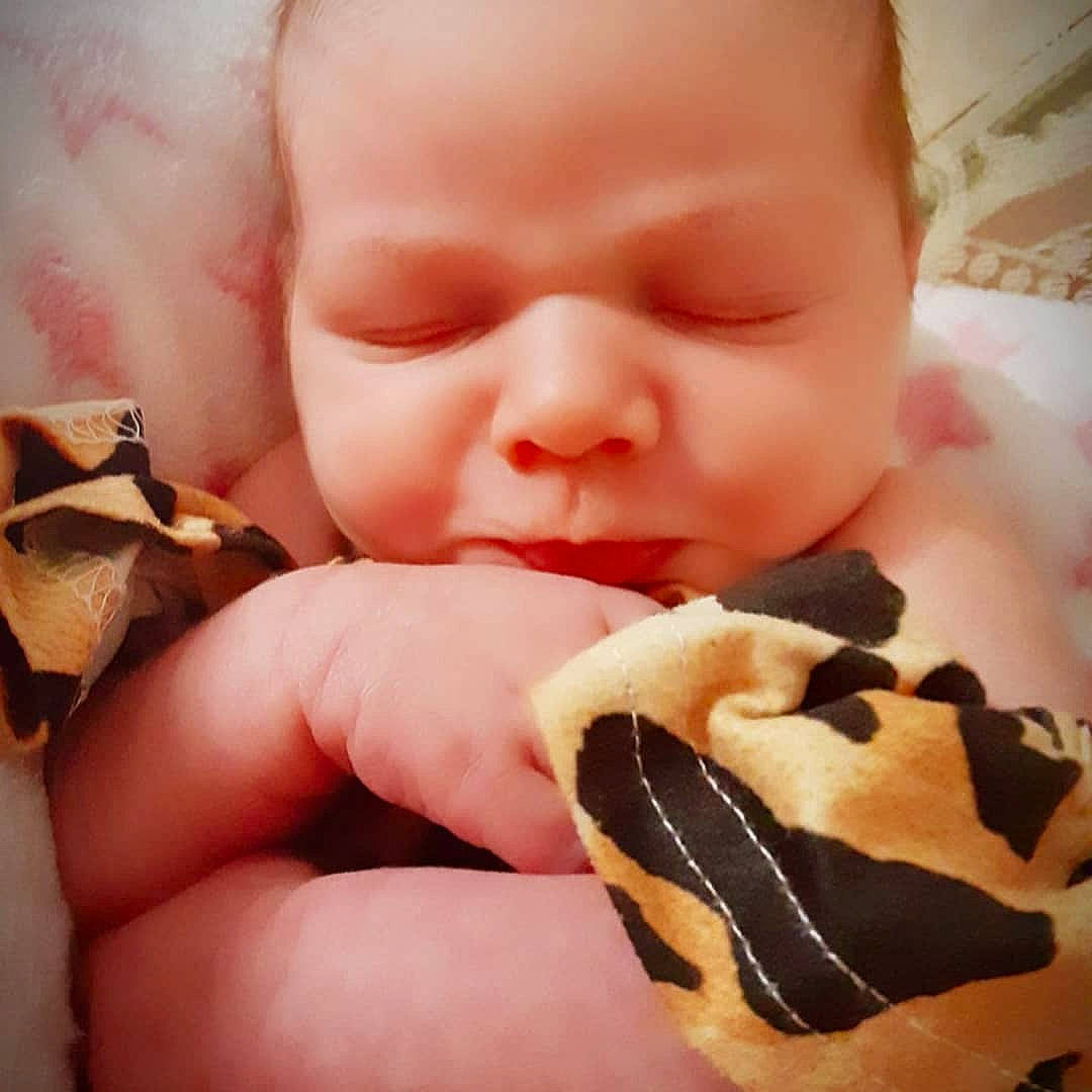 Madison is registered to the contest to win money with this photo: baby, baby_sleeping, baby_toddler_clothing, cheek, comfort, eyelash, finger, food, food_craving, gesture, hand, happy, human, human_body, lip, mouth, nail, nose, person, skin