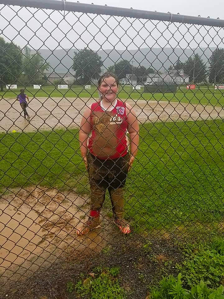 Alexia is registered to the contest to win money with this photo: chain_link_fencing, fence, grass, joy, net, person, play, player, wire_fencing