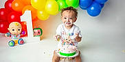 Zaylin is registered to the contest to win money with this photo: toddler, cake, birthday, smiling, balloons, colorful, celebration, first_birthday, cream, happy, child, party, decorations, white_background, cute, food, sitting, toy, face_paint, festive