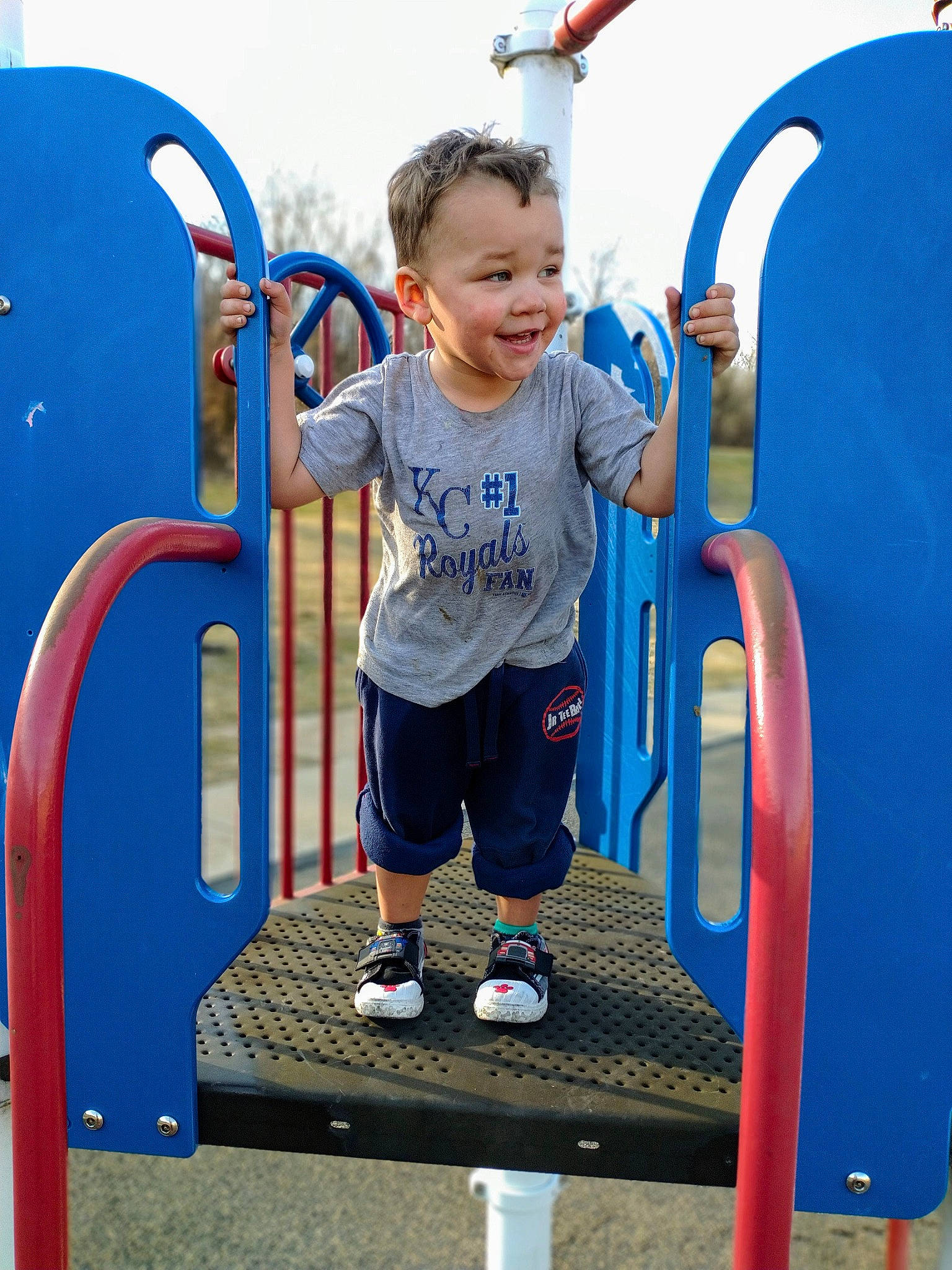 Mikhail joined the competition — help win amazing prizes! baby_toddler_clothing, blue, child, city, electric_blue, fun, gas, leisure, nature, outdoor_play_equipment, person, playground, recreation, shorts, sky, sleeve, smile, standing, t_shirt, toddler