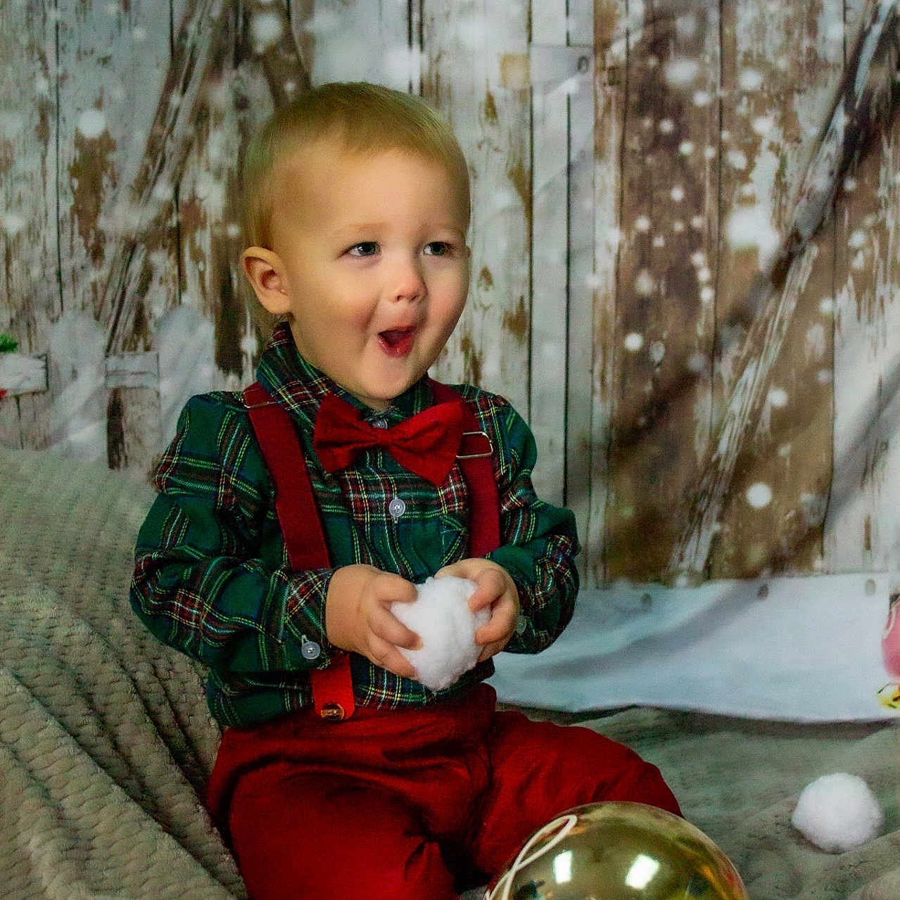Siilus joined the competition — help win amazing prizes! blanket, bow_tie, child, cozy, cute, decor, festive, happy, holiday, indoor, ornament, photography, plaid_shirt, portrait, red_suspender, smiling, snowball, toddler, winter, wooden_background