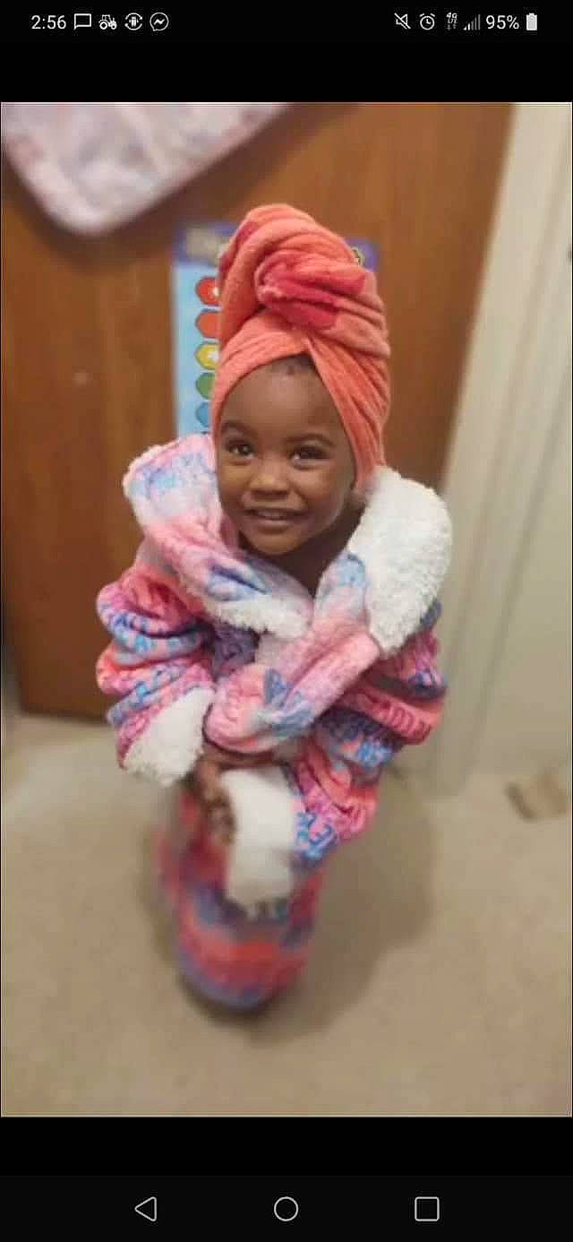 Savannah is registered to the contest to win money with this photo: baby, cap, child, clothing, face, fashion_accessory, fur, happy, headgear, headwear, human_body, joy, knit_cap, magenta, person, pink, room, sleeve, smile, textile