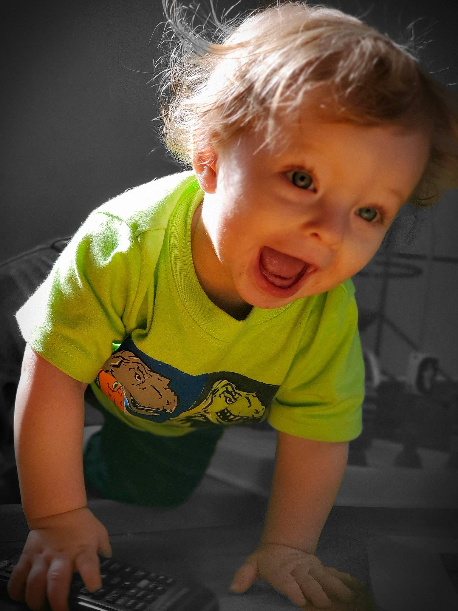 Shawn Jr is registered to the contest to win money with this photo: arm, baby, blond, cheek, child, chin, crawling, facial_expression, floor, fun, hair, hairstyle, leg, nose, person, play, sitting, skin, smile, t_shirt