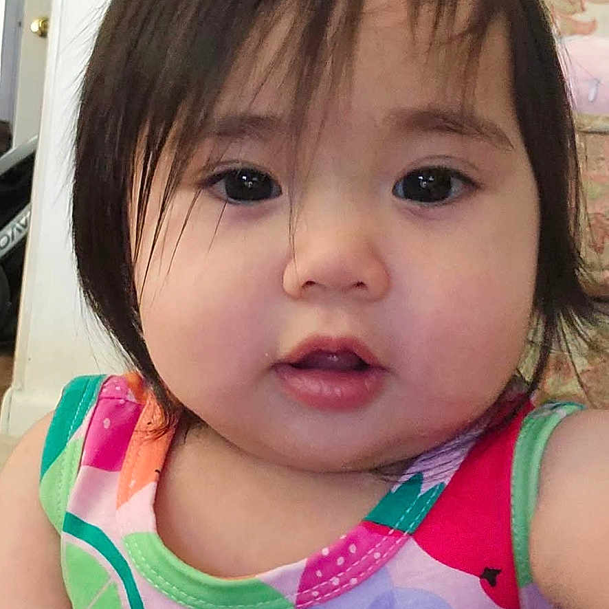 Brooklyn joined the competition — help win amazing prizes! toddler, child, baby, portrait, face, indoor, colorful_clothing, fruit_pattern, hair, person, cute, young_child, smiling, sitting, home, couch, playful_expression, bright_colors, closeup, young