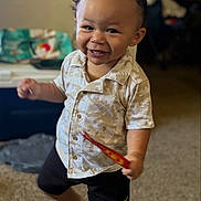 Dakota joined the competition — help win amazing prizes! toddler, child, smile, indoor, carpet, shorts, shirt, face, person, happy, motion, hair, toy, footwear_absent, living_room, background_blur, clothing, cute, expression, playful