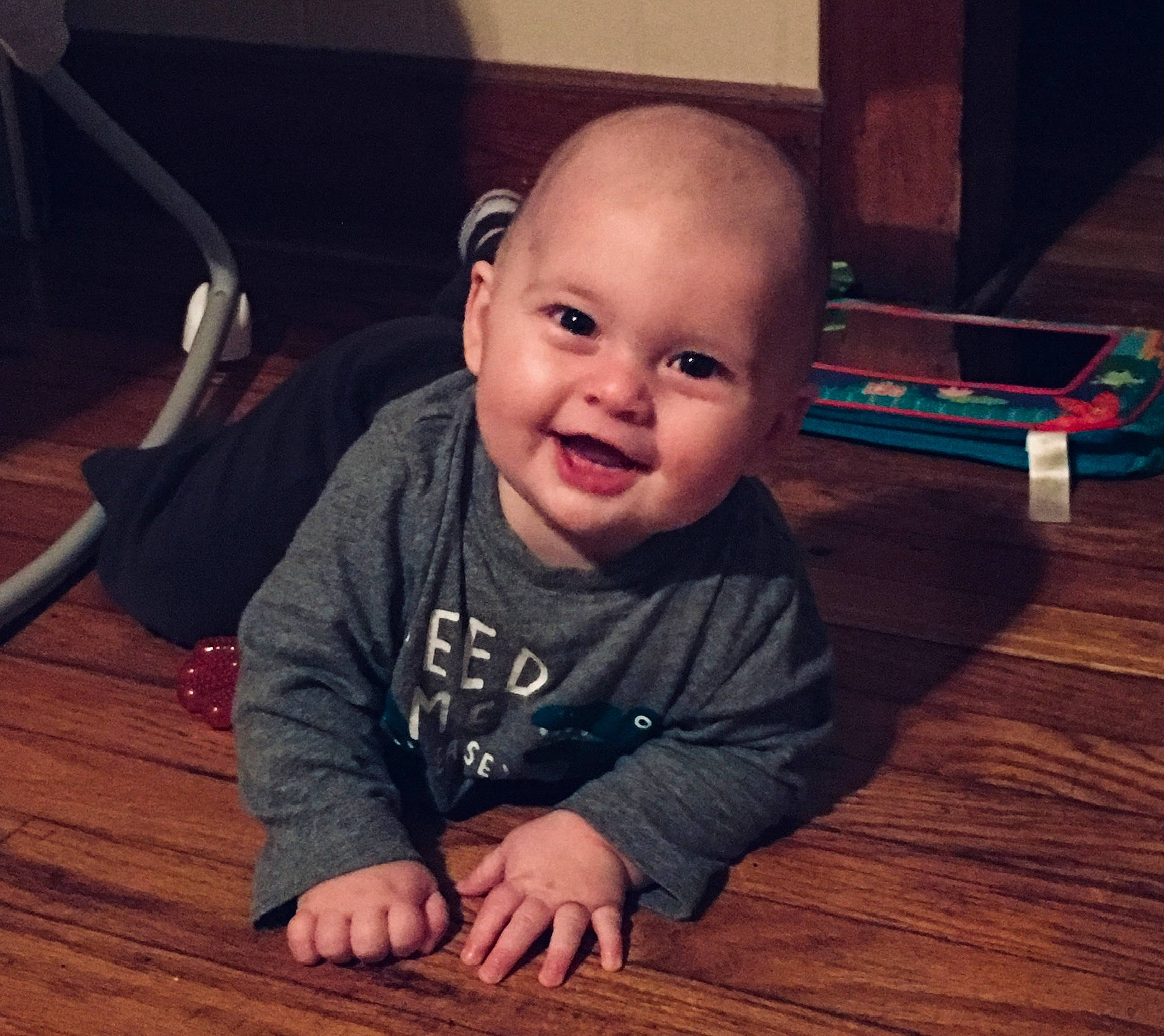 Bryer joined the competition — help win amazing prizes! arm, baby, cheek, child, chin, cool, eye, face, facial_expression, floor, flooring, forehead, head, human, nose, organ, person, skin, smile, toddler
