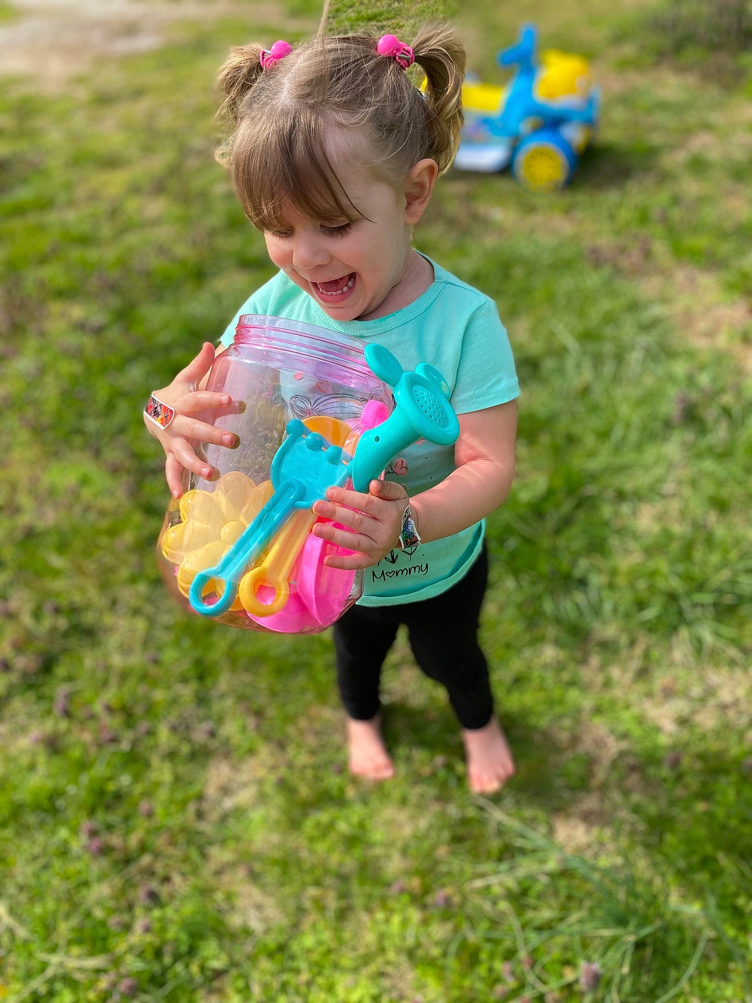 Bailee joined the competition — help win amazing prizes! baby_toddler_clothing, child, dress, facial_expression, fun, gesture, grass, grassland, green, hand, happy, leaf, leisure, meadow, people_in_nature, person, pink, plant, shorts, smile