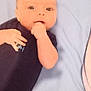 baby, infant, pacifier, blanket, onesie, hand, face, lying_down, looking, curious, indoors, child, skin, head, cute, young, expression, person, resting, toddler