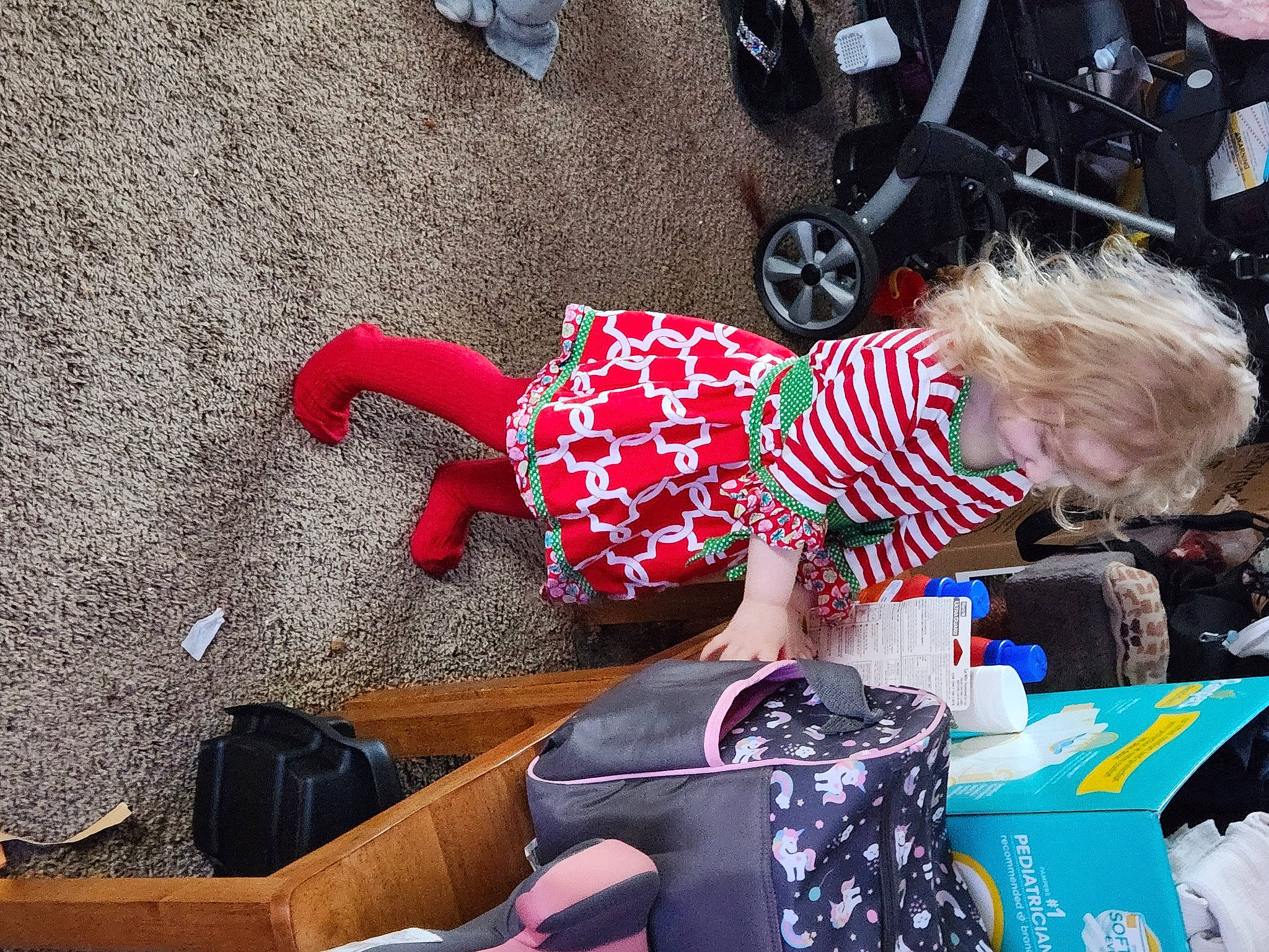 Crystal joined the competition — help win amazing prizes! automotive_tire, baby, bag, child, event, flooring, fun, holiday, human_leg, luggage_and_bags, pattern, person, play, sandal, sidewalk, sitting, tire, toddler, travel, vacation