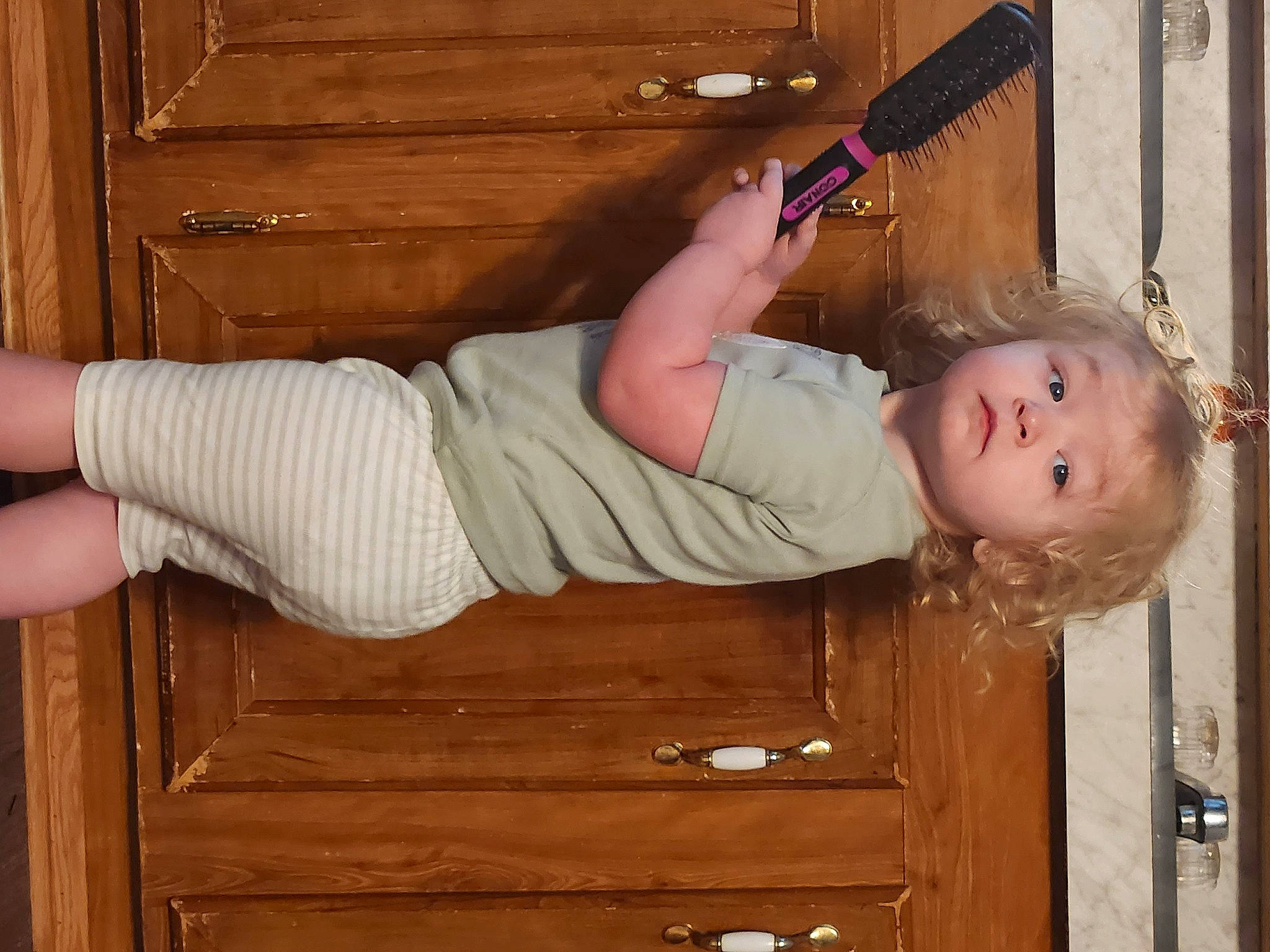 Crystal joined the competition — help win amazing prizes! baby, baby_products, baby_toddler_clothing, child, comfort, drawer, elbow, foot, hardwood, human_body, human_leg, knee, leg, pattern, person, sitting, thigh, toddler, varnish, wood