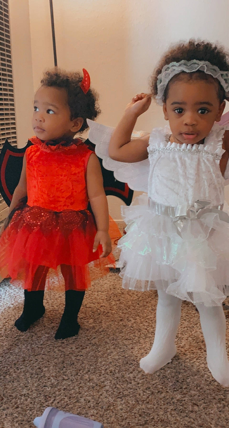 Tori And True is registered to the contest to win money with this photo: arm, baby_toddler_clothing, dress, face, facial_expression, fashion, gesture, hair, hairstyle, hand, happy, head, human_body, interaction, leg, person, shoulder, skin, standing, textile