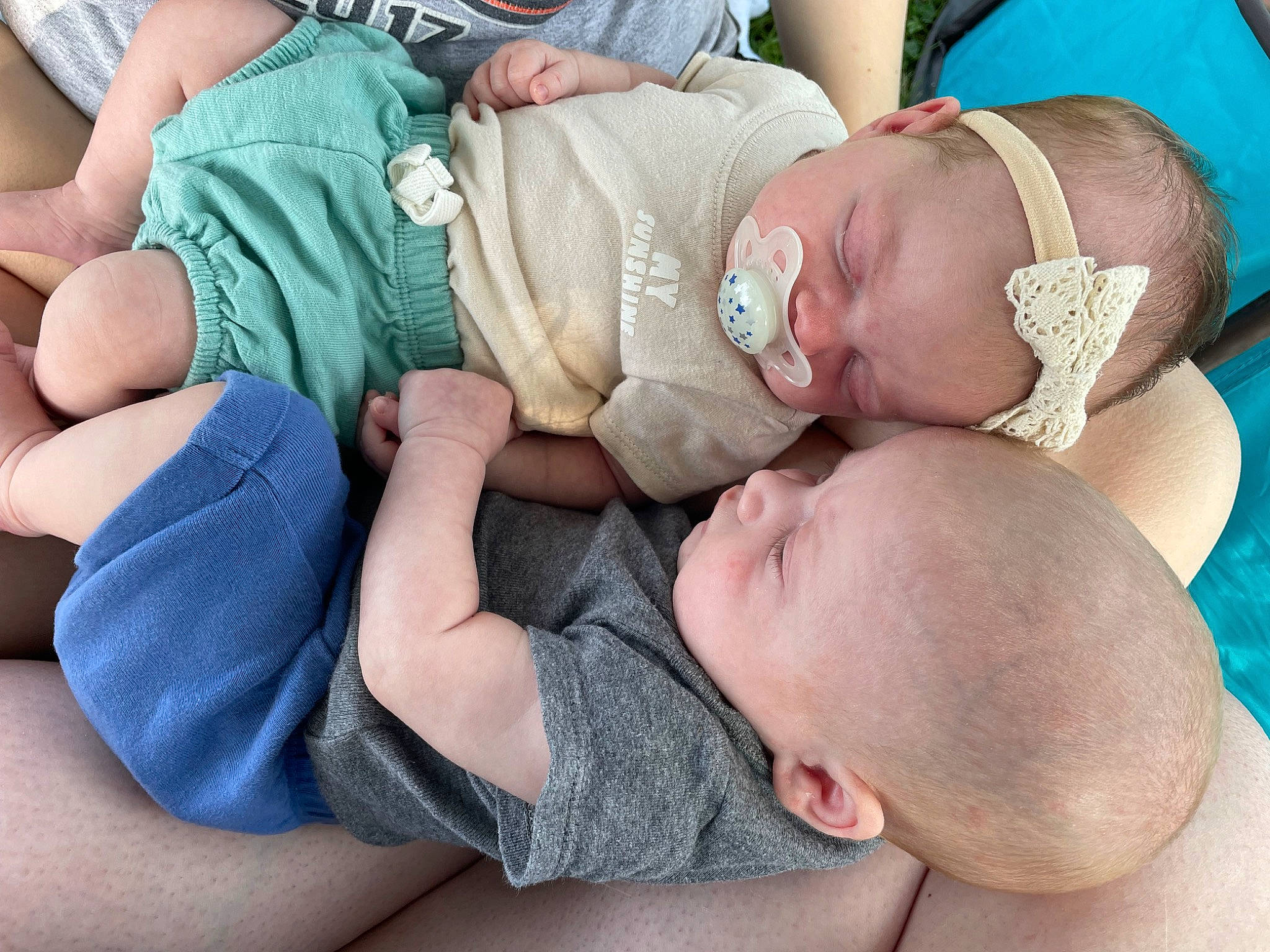 Jaxton joined the competition — help win amazing prizes! baby, baby_products, baby_toddler_clothing, barefoot, blue, cheek, child, comfort, finger, foot, head, human_leg, nail, pattern, person, product, sitting, skin, thigh, thumb