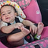 Nevaeh joined the competition — help win amazing prizes! baby, child, infant, car_seat, safety_harness, sitting, smiling, face, feet, hands, legs, outdoor_light, vehicle, pink, butterfly_pattern, floral_pattern, portrait, happy, travel, family