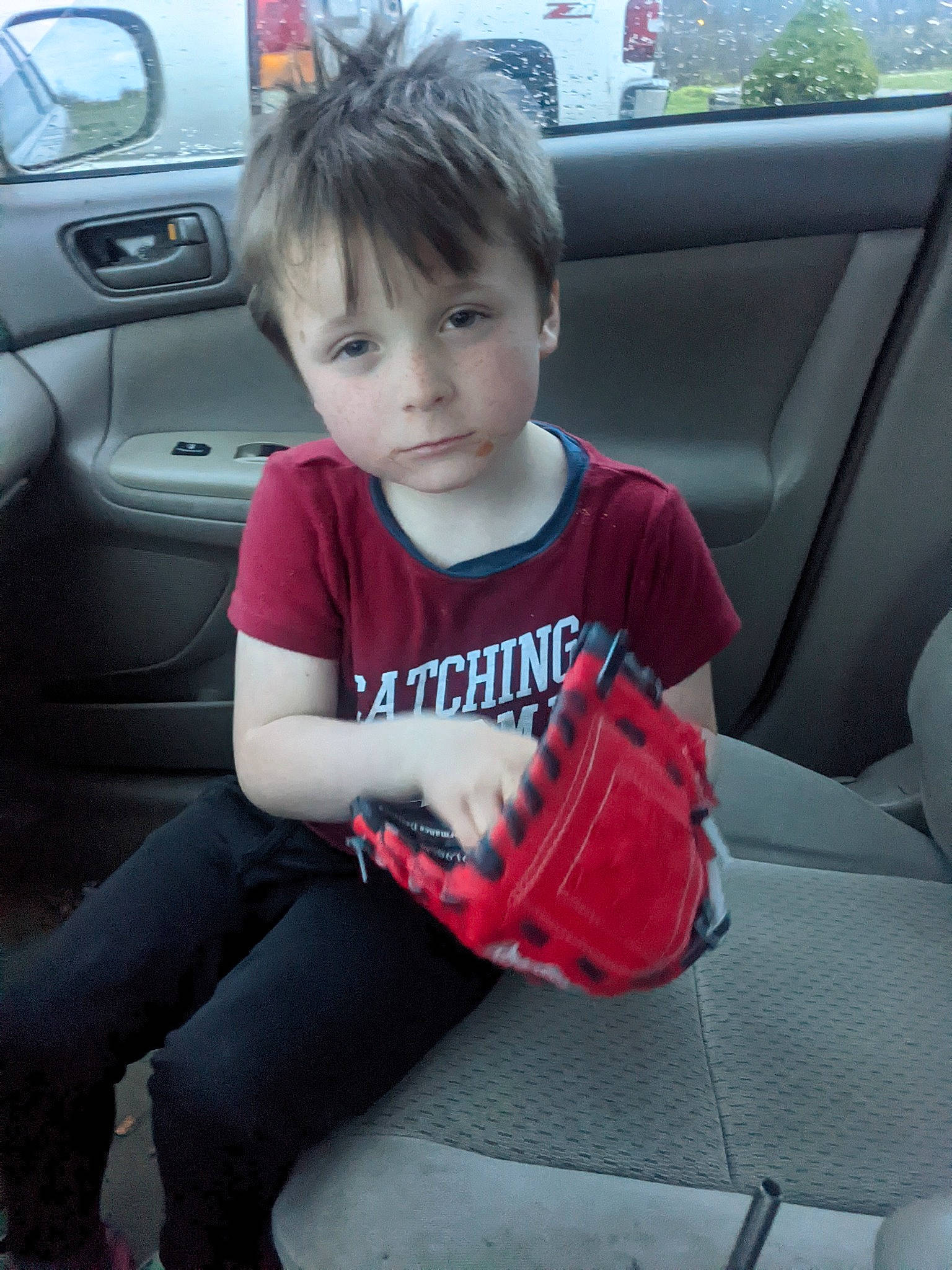 Colton is registered to the contest to win money with this photo: auto_part, automotive_design, automotive_exterior, automotive_tire, automotive_wheel_system, bumper, car, car_seat, car_seat_cover, comfort, family_car, jeans, knee, motor_vehicle, person, personal_luxury_car, steering_wheel, toddler, vehicle, vehicle_door