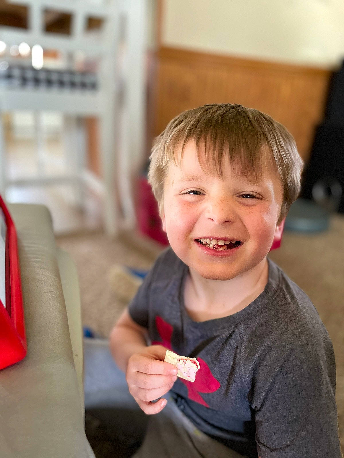 Colton is registered to the contest to win money with this photo: carmine, cheek, child, chin, event, face, fun, gesture, hair, hairstyle, happy, joy, laugh, nose, person, sitting, skin, smile, t_shirt, thumb