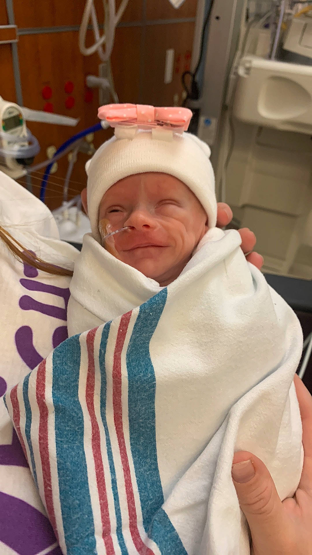 Aubrey Jayde is registered to the contest to win money with this photo: baby, baby_safety, cheek, child, comfort, event, finger, fur, happy, headgear, headwear, health_care, hospital, linens, medical, medical_equipment, person, room, service, smile