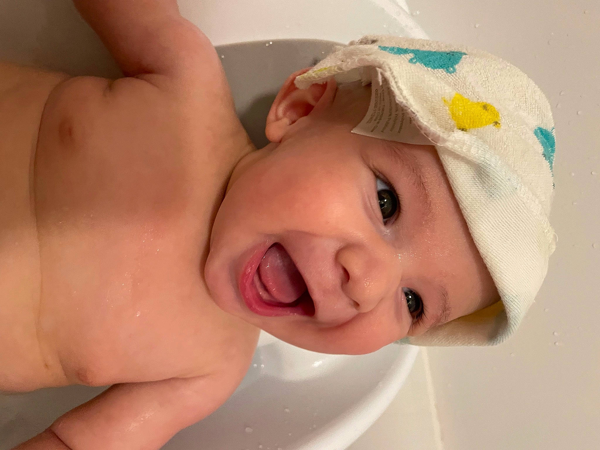 Asher is registered to the contest to win money with this photo: baby, baby_toddler_clothing, bathing, cheek, chest, child, eye, eyebrow, eyelash, face, fashion_accessory, hair_accessory, happy, hat, headgear, headpiece, headwear, lip, person, skin