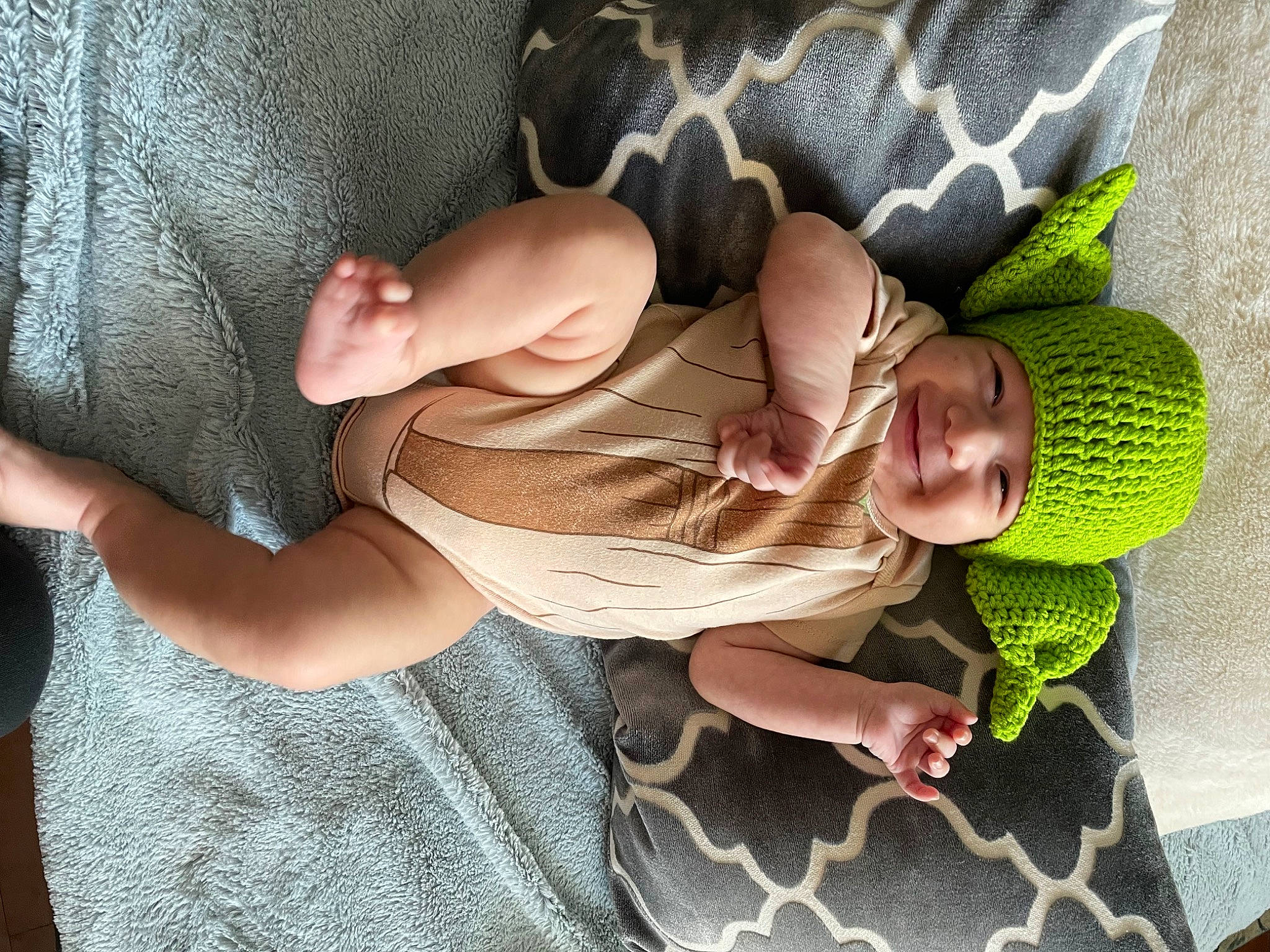 Asher joined the competition — help win amazing prizes! abdomen, baby, child, comfort, elbow, finger, foot, fun, happy, headwear, human_body, human_leg, joint, joy, knee, lap, leg, linens, person, skin