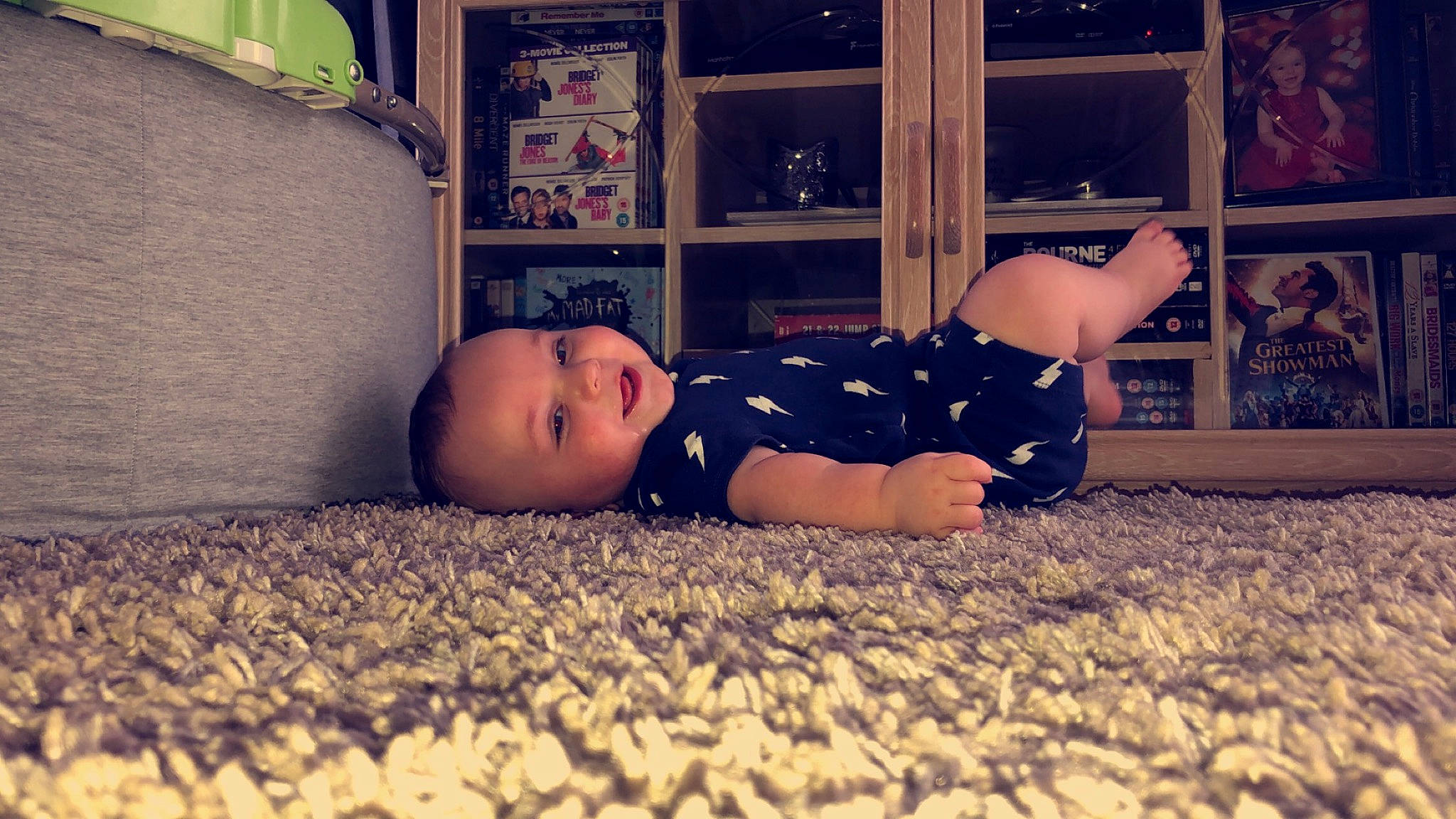 Callan is registered to the contest to win money with this photo: baby, bedtime, cheek, child, floor, flooring, head, joy, night, person, sky, toddler