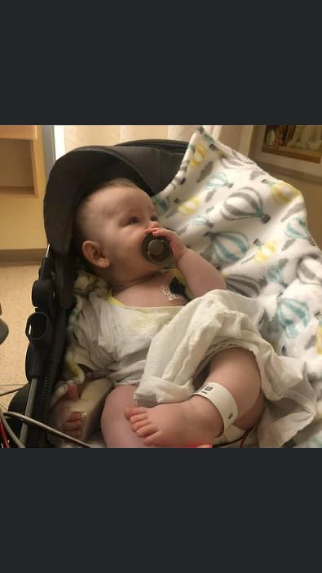 Easton is registered to the contest to win money with this photo: abdomen, baby, baby_products, baby_safety, baby_toddler_clothing, bedtime, cheek, child, comfort, event, fun, gesture, happy, mouth, person, room, sitting, skin, smile, thumb