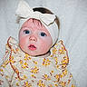 baby, infant, headband, bow, blue_eyes, floral_dress, white_blanket, cute, portrait, child, young, soft_lighting, indoors, closeup, expression, sitting, adorable, face, person, clothing