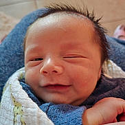 Avery joined the competition — help win amazing prizes! newborn, baby, infant, face, smile, blanket, hand, skin, cute, cozy, closeup, portrait, child, human, baby_clothing, happy, sleepy, soft, warm, indoors